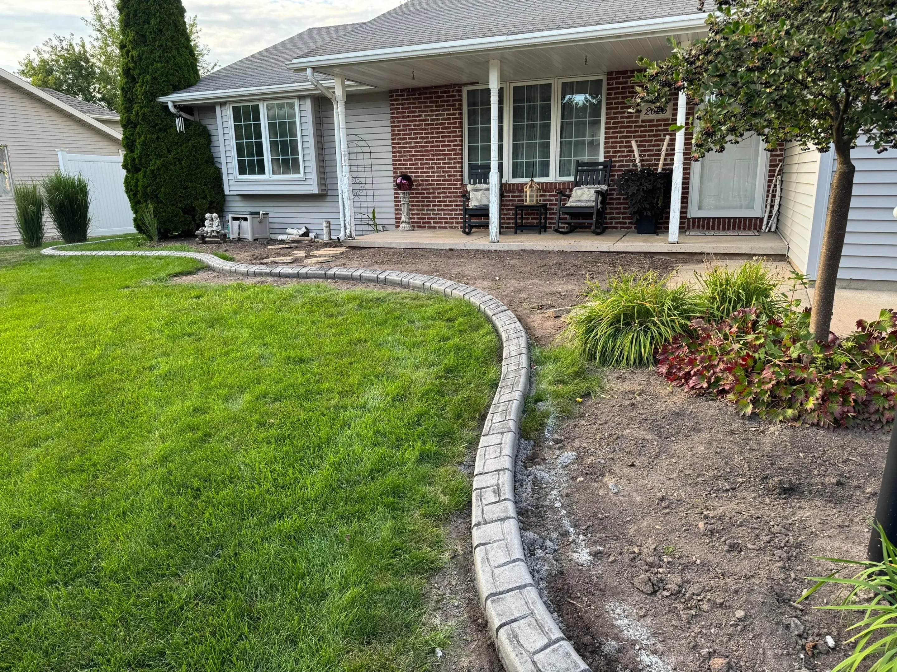 Tree ring curbing in residential landscape